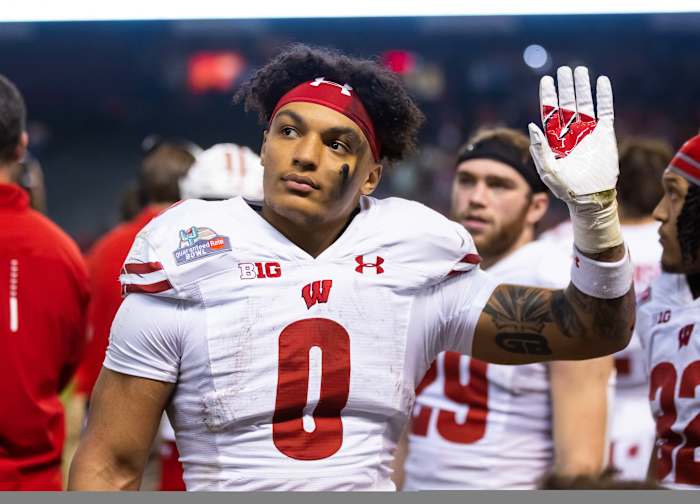 Dec 27, 2022; Phoenix, Arizona, USA; Wisconsin Badgers running back Braelon Allen (0) reacts against the Oklahoma State Cowboys in the second half of the 2022 Guaranteed Rate Bowl at Chase Field. Mandatory Credit: Mark J. Rebilas-USA TODAY Sports